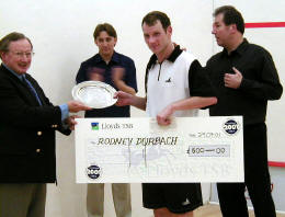 Durbach picks up the winner's cheque ...